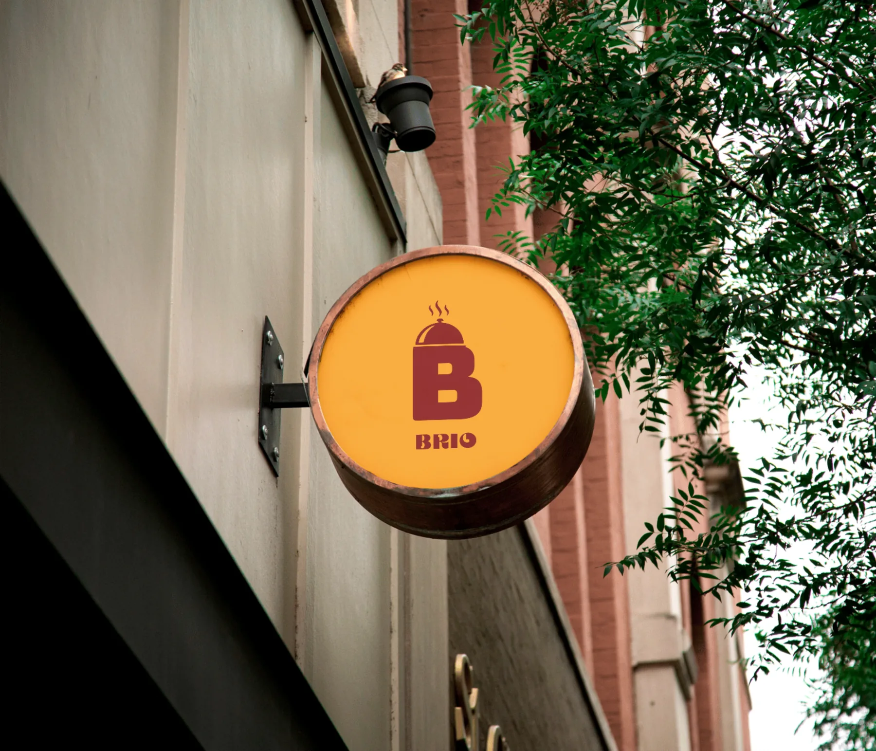 Brio circular restaurant sign on a street wall